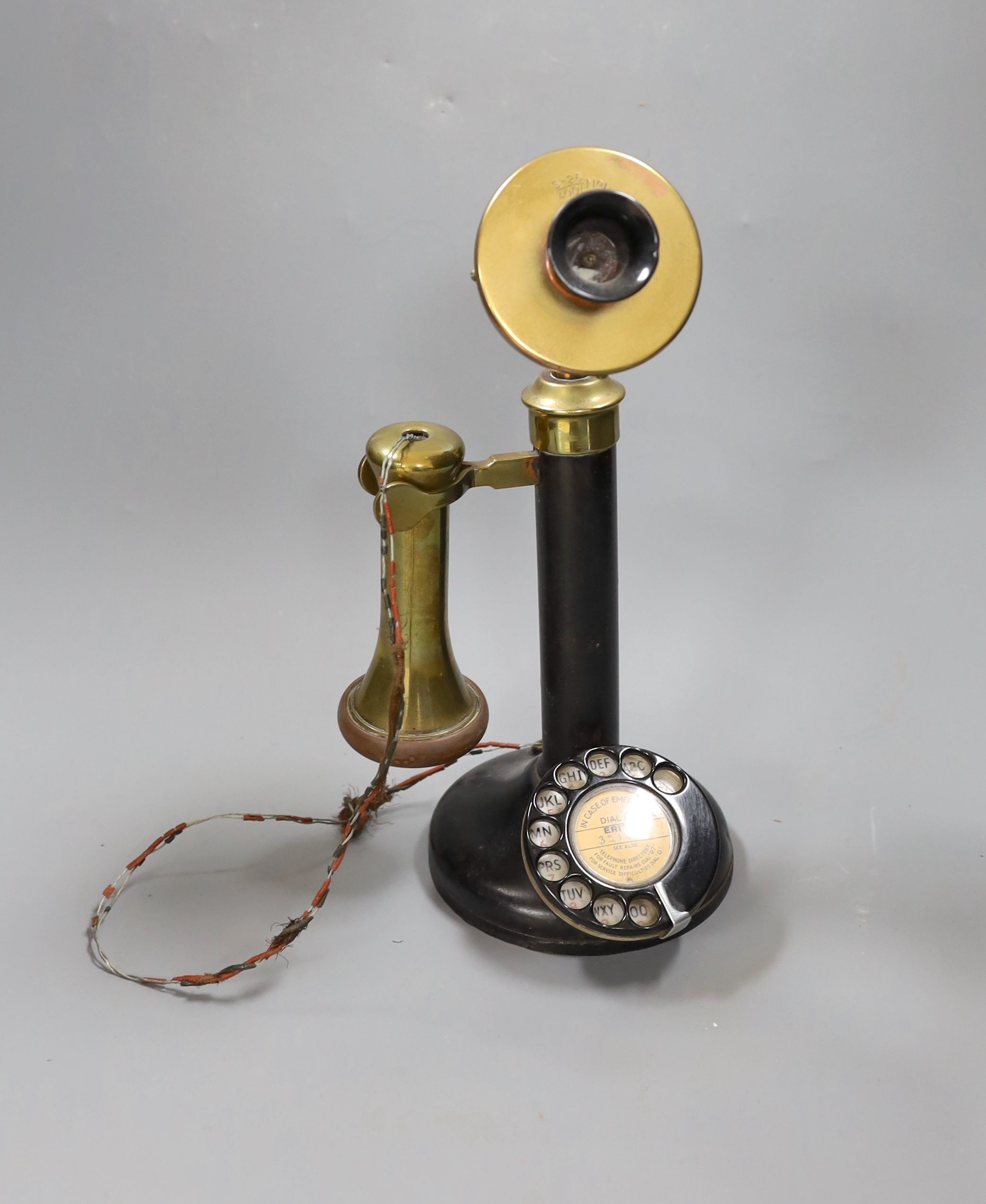 A brass mounted pillar telephone, 34cms high.